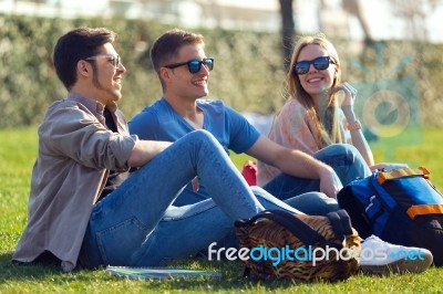 A Group Of Friends Talking In The Street After Class Stock Photo