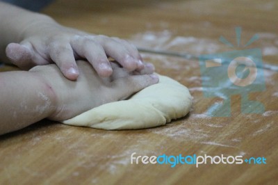 A Little Boy Makes Dough Stock Photo