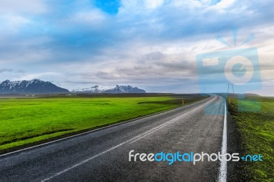 A Long Straight Road And Blue Sky Stock Photo