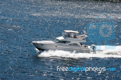 A Motorboat Rapidly Cruising The Straits Between Victoria And Va… Stock Photo