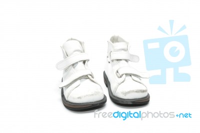 A Pair Of Old White Kid's Orthopedic Footwear Isolated On White Stock Photo