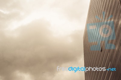 A Part Of Modern Business Building Against Sky Stock Photo