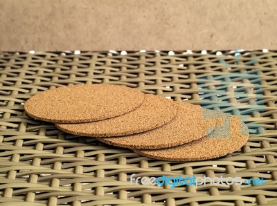 A Pile Of Hot Cup Serving Tray Made Of Compressed Sawdust On A Woven Bamboo Chair Stock Photo