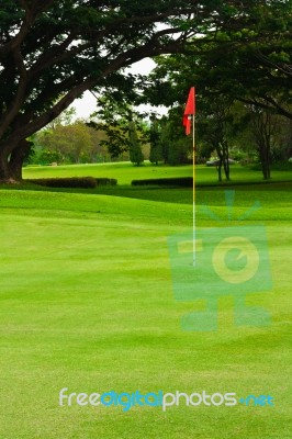 A Red Flag Identifies The Hole Stock Photo