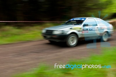 A. Tracey Driving Toyota Corolla Stock Photo