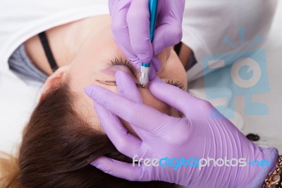 A Woman Getting Permanent Make Up Stock Photo