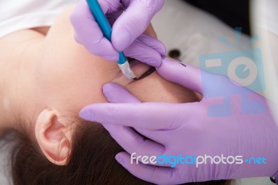 A Woman Getting Permanent Make Up Stock Photo