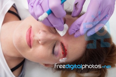 A Woman Getting Permanent Make Up Stock Photo