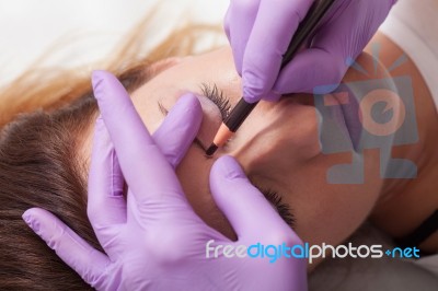 A Woman Getting Permanent Make Up Stock Photo