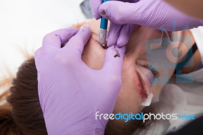 A Woman Getting Permanent Make Up Stock Photo