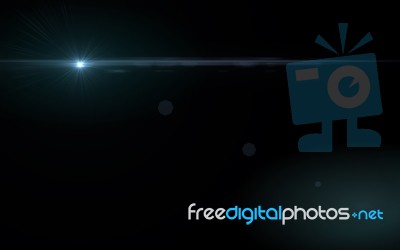 Abstract Blue Lens Flare Light Over Black Background Stock Image