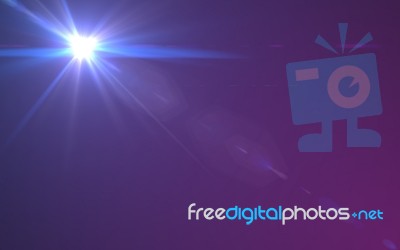 Abstract Digital Lens Flare In Black Background Stock Image