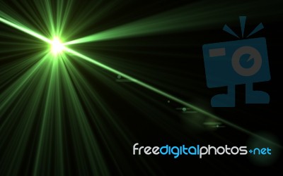 Abstract Lens Flare Green Light And Black Background Stock Image