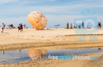 Abstract Of Blurred People On The Beach Stock Photo