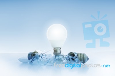 Abstract Of Led Light Bulb Glowing On Light Blue Background With… Stock Photo