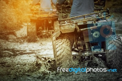 Action Shot Of Sport Atv Vehicle Running In Mud Track Stock Photo