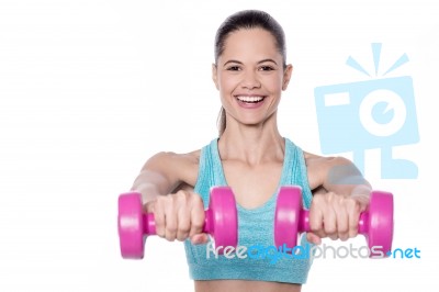 Active Young Woman Posing With Dumbbells Stock Photo