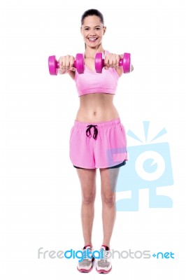 Active Young Woman Posing With Dumbbells Stock Photo