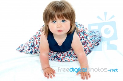 Adorable Baby Girl Crawling Stock Photo