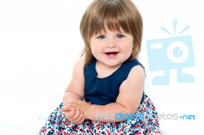 Adorable Baby Girl Sitting Stock Photo