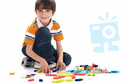 Adorable Caucasian Boy Joining The Blocks Stock Photo