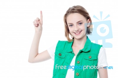 Adorable Girl Pointing Up Stock Photo