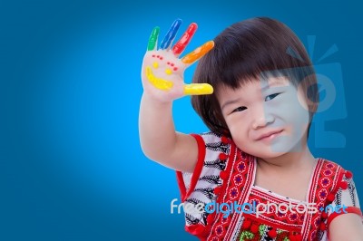 Adorable Little Asian (thai) Girl Painting Her Palm, On Blue Bac… Stock Photo