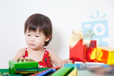 Adorable Little Girl With Present Stock Photo