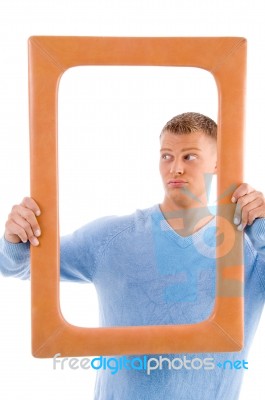 Adult Man Holding Frame Stock Photo