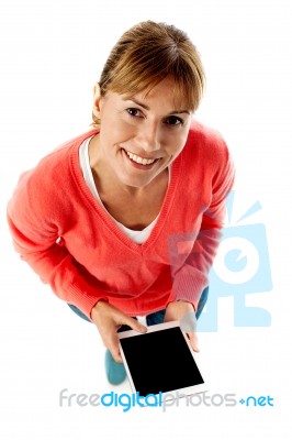 Aerial Shot Of A Lady Using Tablet Pc Stock Photo