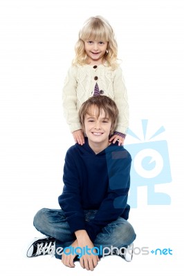 Affectionate Brother And Sister Posing For A Portrait Stock Photo