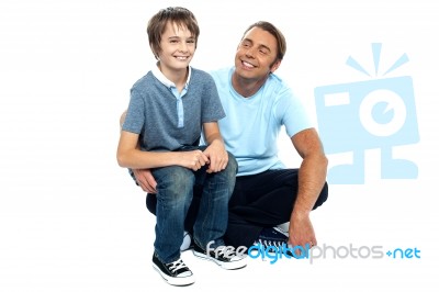 Affectionate Father Admiring His Sweet Son On His Lap Stock Photo