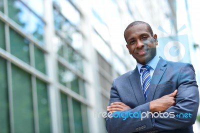 African Business Man Keeping Arms Crossed Stock Photo