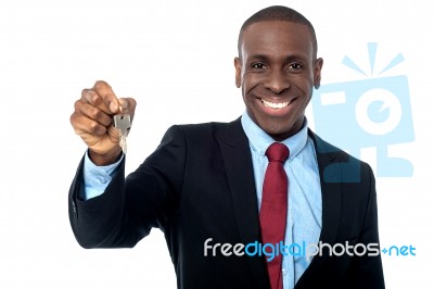 African Businessman Holding A Key Stock Photo