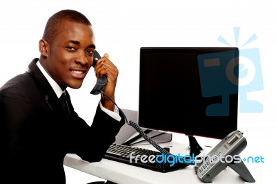 African Businessman Holding Phone Stock Photo