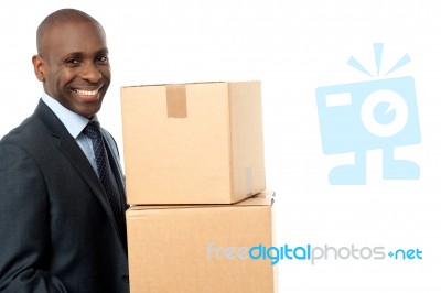 African Corporate Man Holding Card Box Stock Photo