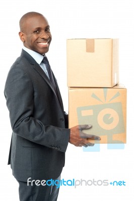 African Corporate Man Holding Card Box Stock Photo