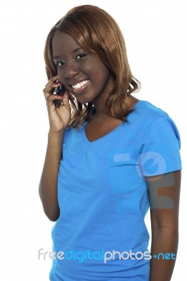 African Girl Talking Over Phone Stock Photo