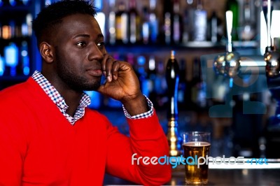 African Guy At Pub Stock Photo