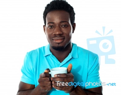 African Guy Holding Coffee Mug Stock Photo