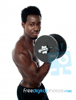 African Guy Lifting Dumbbells Stock Photo