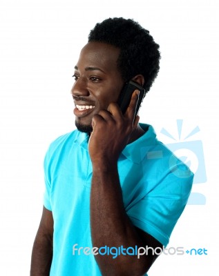 African Guy Talking Over Phone Stock Photo