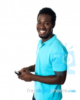 African Man Using Cellphone Stock Photo