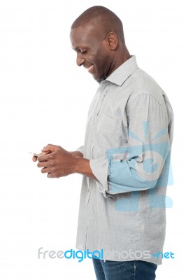 African Man Using His Mobile Phone Stock Photo