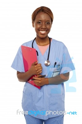 African surgeon holding clipboard Stock Photo