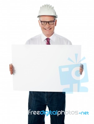 aged Architect showing Blank board Stock Photo