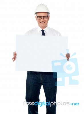 aged Architect showing Blank board Stock Photo