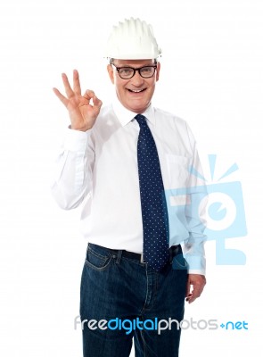 aged builder showing approval sign Stock Photo