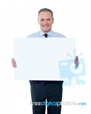 aged Businessman with empty sign Stock Photo