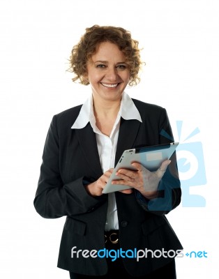 Aged Businesswoman Using tablet PC Stock Photo